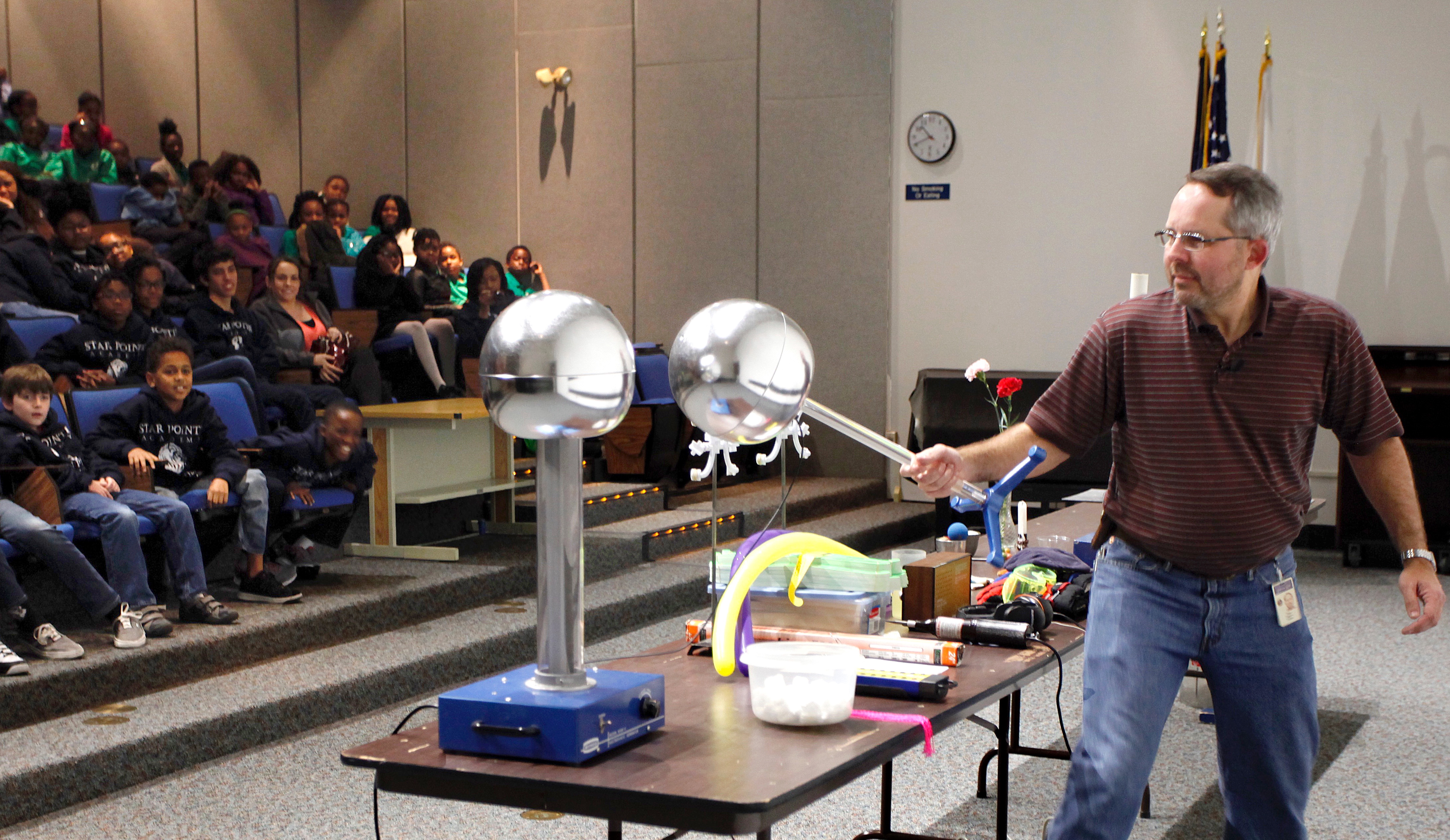 Jefferson Lab’s Steve Gagnon prepares to give an “electrifying” demonstration, using a Van de Graff generator during a Physics Fest program.