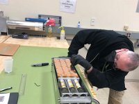 George Jacobs installing screws in frame sides
