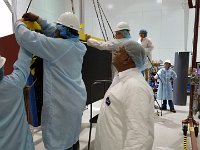 Marc McMullen, Brian Eng, Amrit Yegneswaran, and DSG aligning anchoring bolts on RICH stiffening tool and detector shell