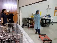 Brian Eng, Sahin Arslan, and Mindy Leffel storing frame beams in clean room