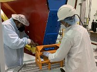 Marc McMullen and Sandro Tomassini installing stiffening tool onto RICH-II detector shell