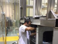 Sahin Arslan installing equipment in SVT electronics rack structure