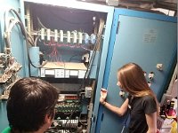 Pablo, Tyler and Amanda looking at the HMS signal conditioners