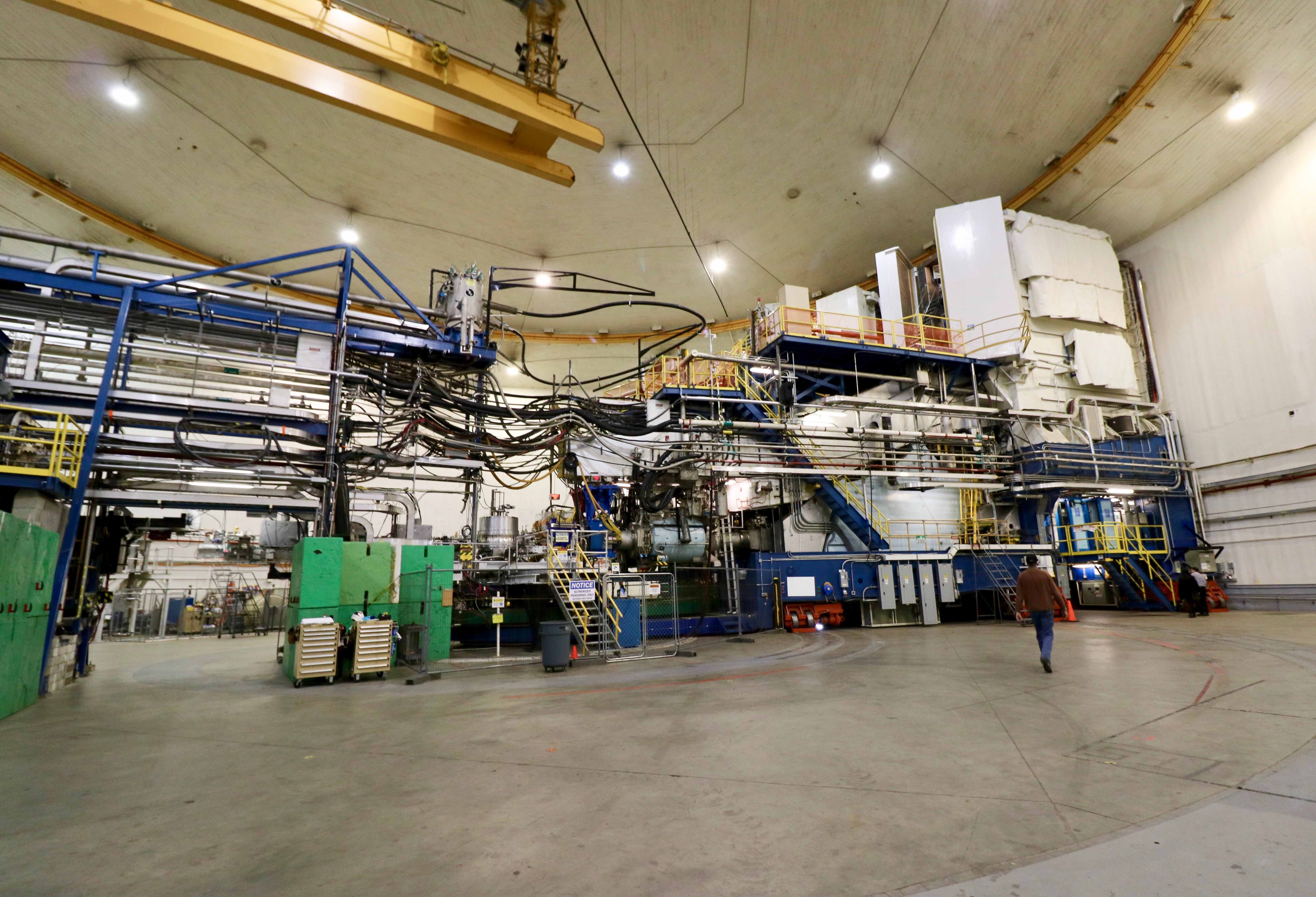 Hall A from floor, showing a person walking toward a high resolution spectrometer