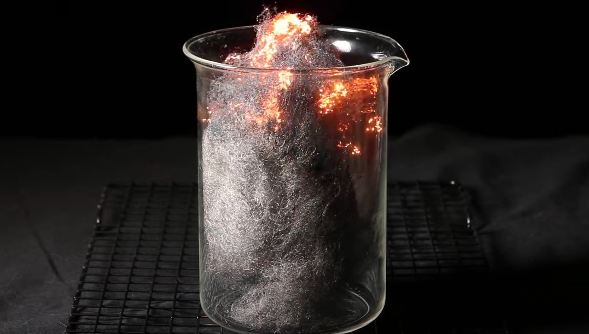 Wool burning in a beaker