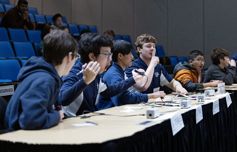 Students at a desk.