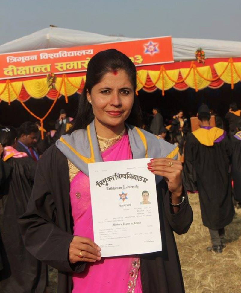 Woman holds degree 
