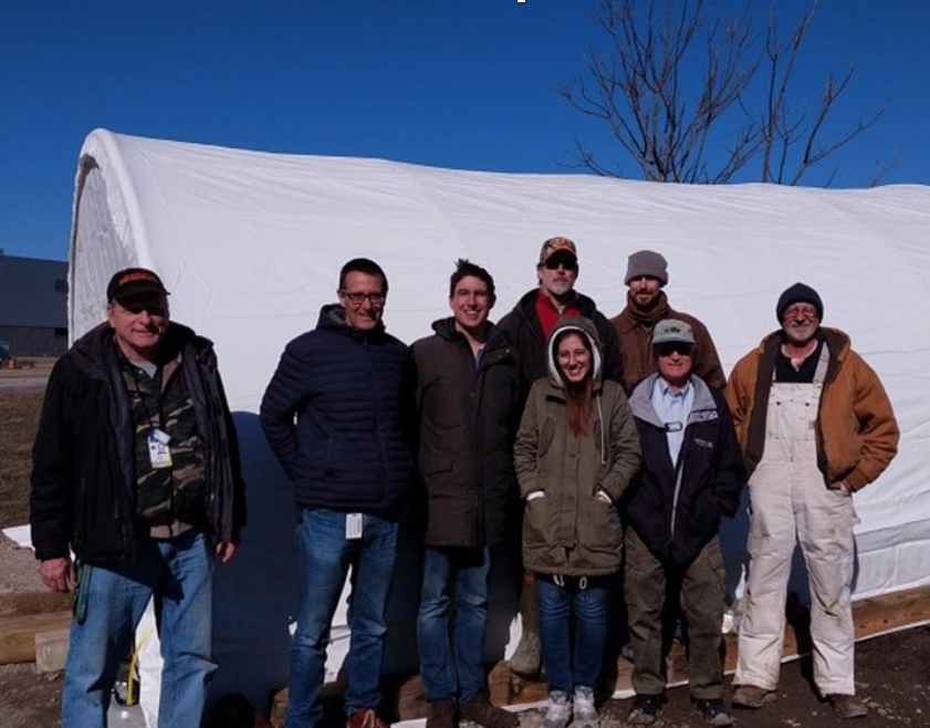 BDX Collaborators standing outside the tent covering the experiment