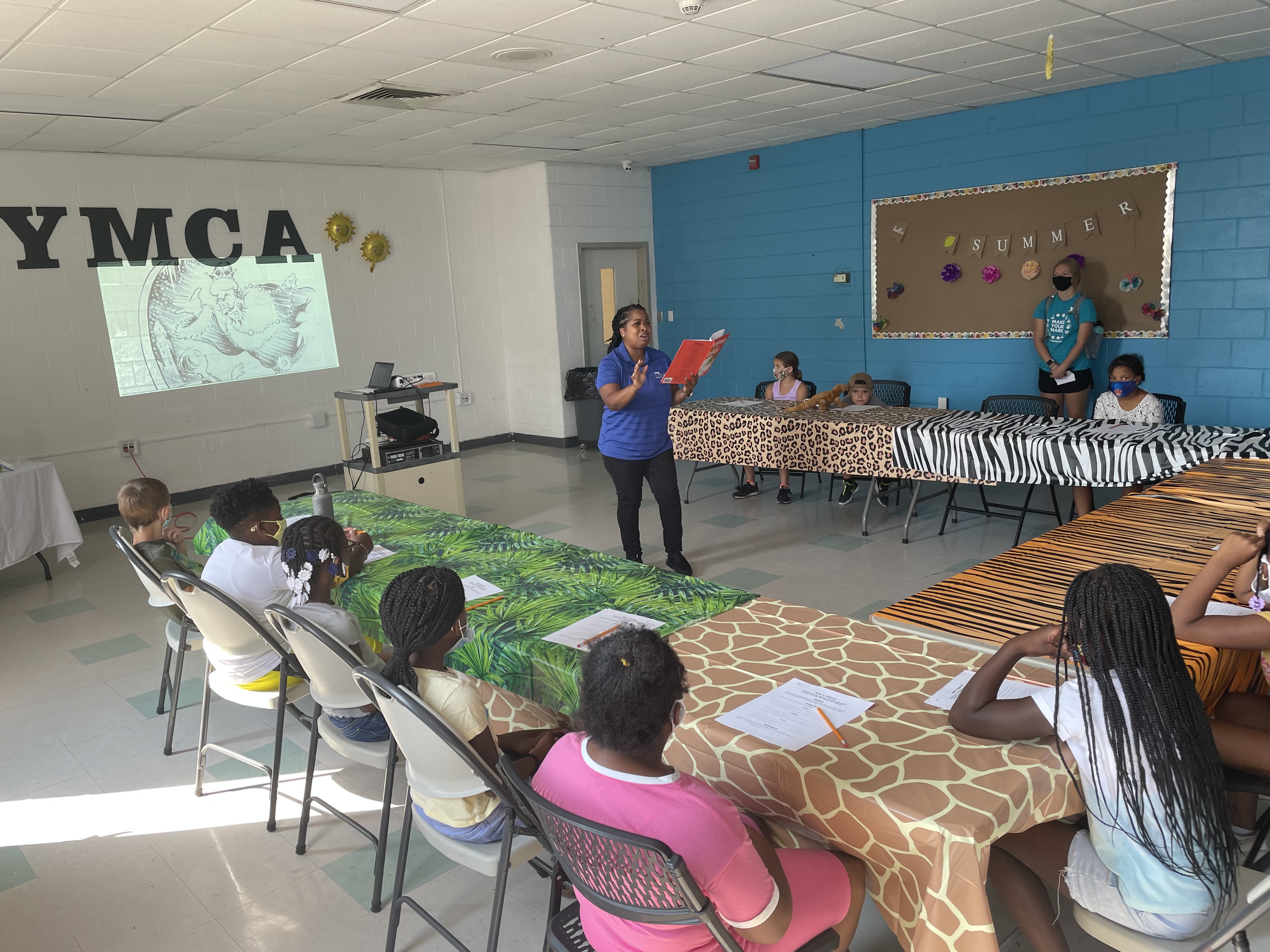 Science Education team member reads to students