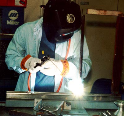 Danny Forehand stick-welds a bracket