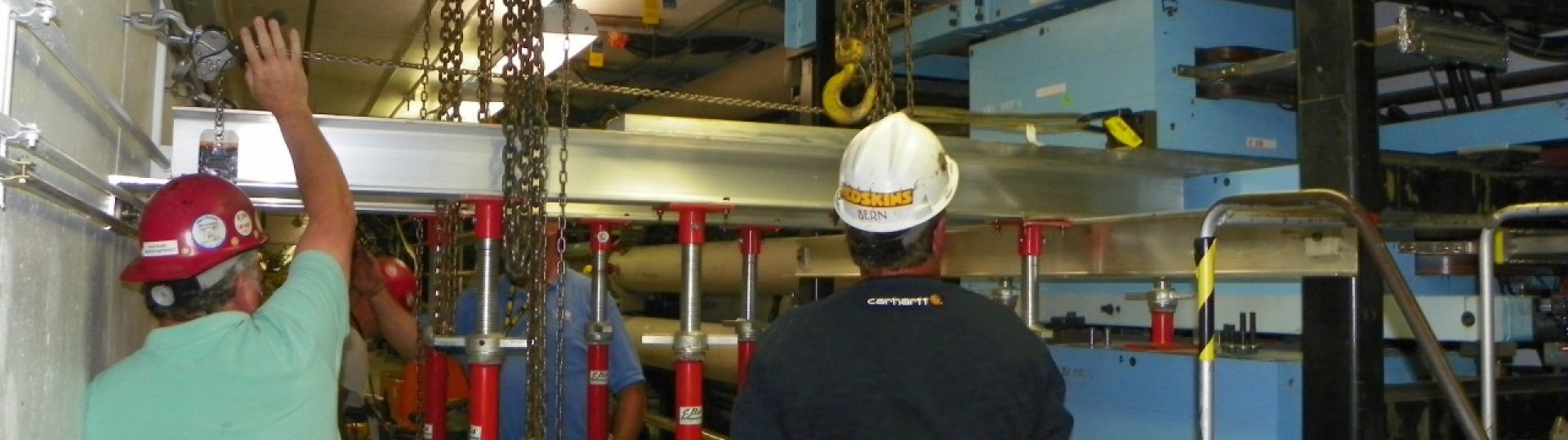 Installation and Vacuum staff removing a dipole magnet for modification
