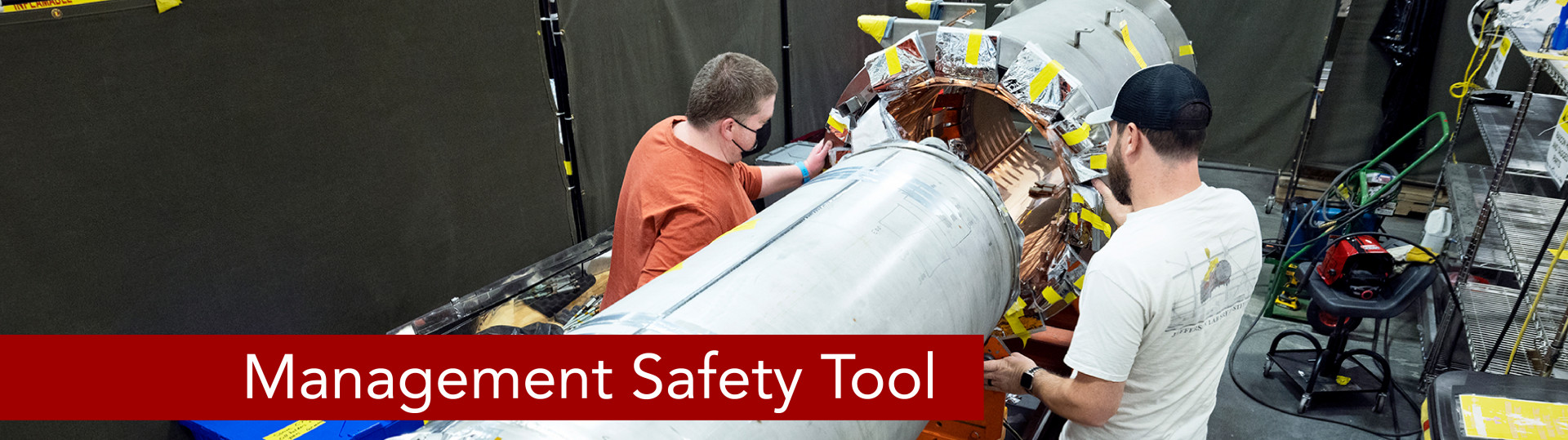 Two workers at work places with caption "Management Safety Tool."