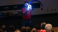 Science Education Administrator Steve Gagnon teaches a group of young learners about the range of science research done at Jefferson Lab during the lab’s monthly Physics Fest held in the JLab CEBAF Center Auditorium in Newport News, Va. 