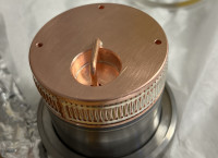 A remade chopper coupler - a copper cylinder attached to a stainless steel joint