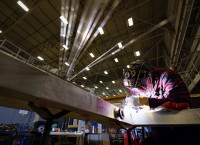 A welder constructing the LOVE letters