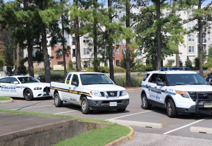 Exercise Response vehicles in SSC parking lot, including a Top Guard truck nad two NNPD patrol vehicles