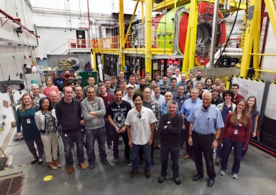 Hall D collaboration members pose in front of the experimental apparatus