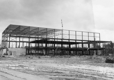 B&W photo of framework of building under construction in 1964
