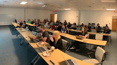 Graduate students attend a lunchtime seminar the 2019 JLUO meeting