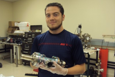 Salvador Sosa implementing vacuum techniques to assemble an ion source at JLab’s polarized electron source vacuum lab.
