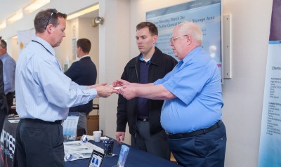 Photo of a lab staff member interacting with a vendor at the Vendor Fair 2018