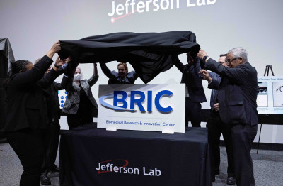 Congressman Bobby Scott (left) assists with the unveiling of the BRIC logo