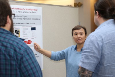 A scientist presents a poster on the results of her LDRD project