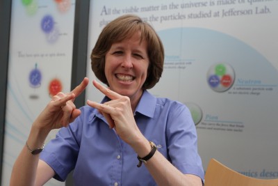 Brita Hampton demonstrates the American Sign Language sign for "camp"