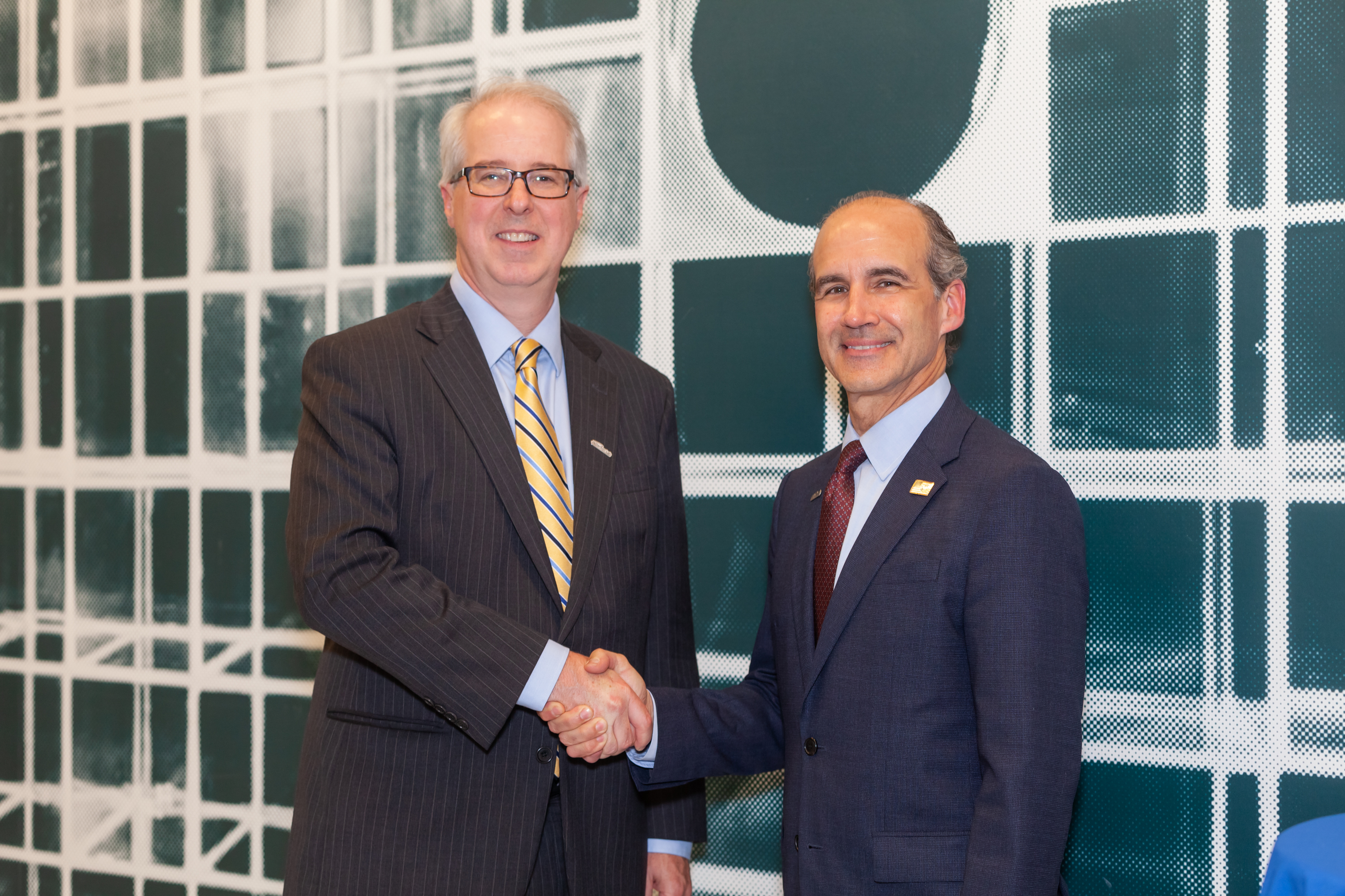 Menezes with Jefferson Lab Director Stuart Henderson